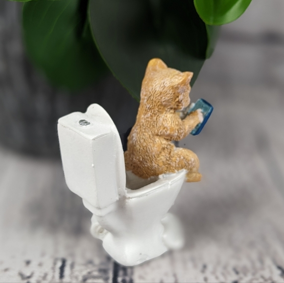 Orange ginger cat using phone while sitting on a toilet, feline statue figurine - Picture 4 of 9